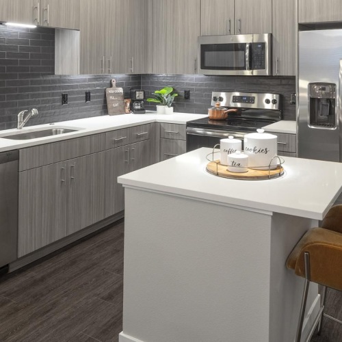 a kitchen with a table and chairs